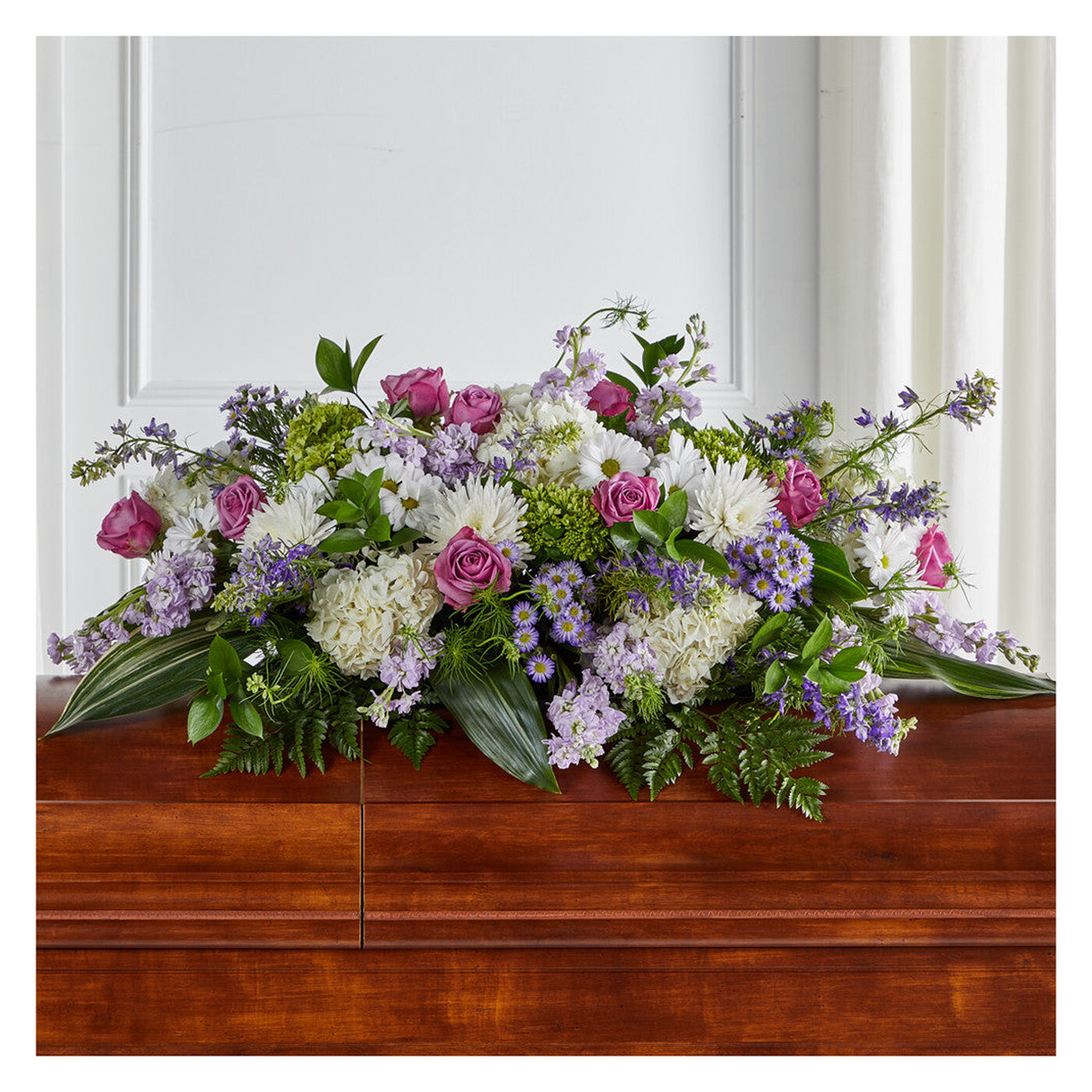 Meadows of Serenity Casket Spray flower arrangement