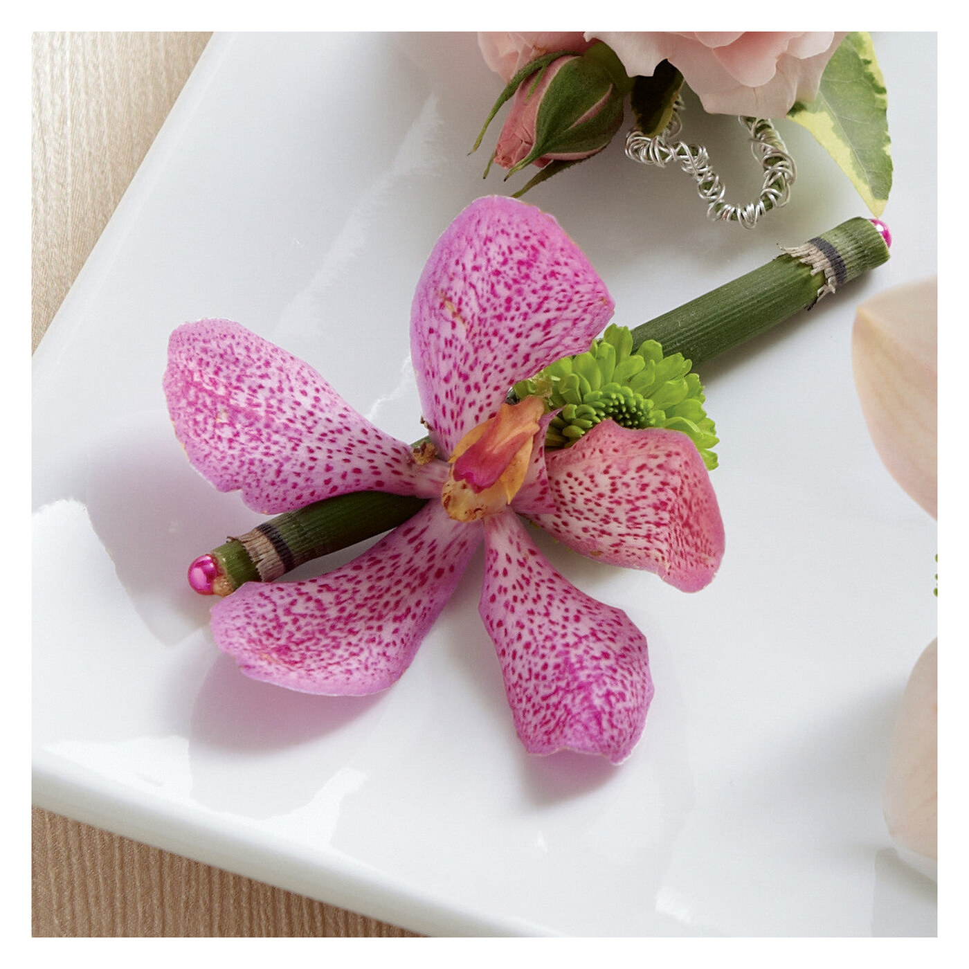 Pink Mokara Boutonniere flower arrangement