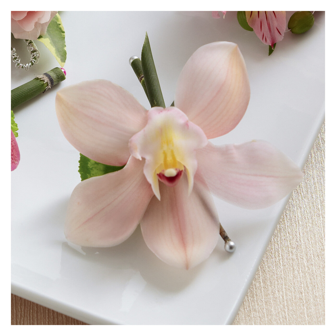 Pink Cymbidium Boutonniere flower arrangement